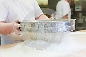 Male baker baking bread