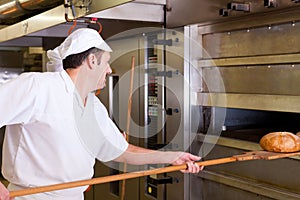 Male baker baking bread