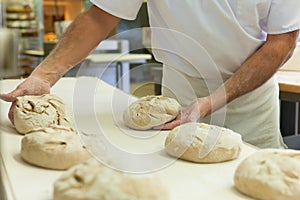 Male baker baking bread