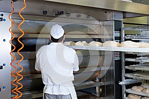 Male baker baking bread