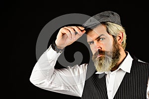 Male beauty standards. Portrait of mature man in victorian gangster outfit. bearded man hipster isolated on black. male