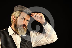 Male beauty standards. Portrait of mature man in victorian gangster outfit. bearded man hipster isolated on black. male