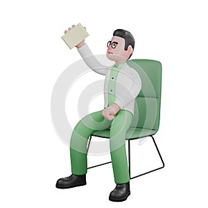 A male biologist is sitting holding a paper in his left hand photo