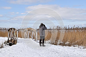 Male birder in winter season photo