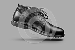 Male black shoe on a gray background