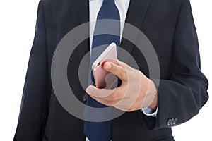 Male in black suit holding mobile phone in hands
