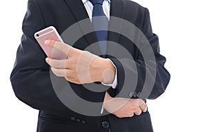 Male in black suit holding mobile phone in hands