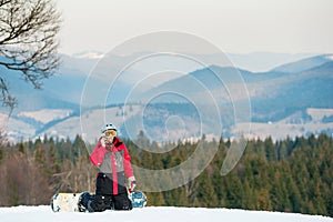 Male boarder on his snowboard at winer resort