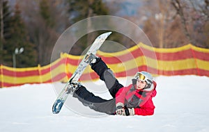 Male boarder on his snowboard at winer resort