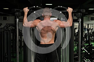 Male Bodybuilding Athlete Doing Pull Ups