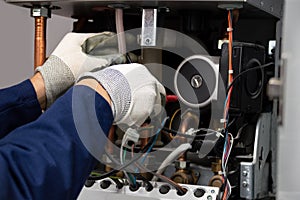 male boiler technician repairing