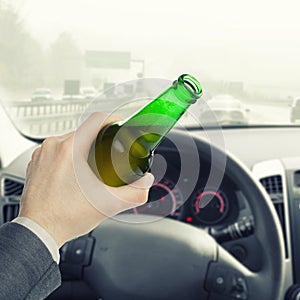 Male with bottle of beer while driving car - 1 to 1 ratio