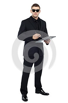 Male bouncer holding clipboard photo