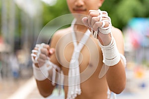 Male boxer of Mauy Thai boran showing on guard before the flight time.