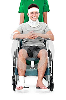 Male with broken arm and foot using wheel chair