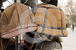 Male brown decorated winter hats on rack
