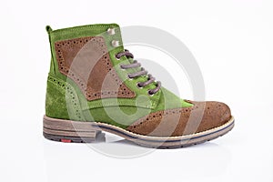 Male brown and green leather boot on white background.