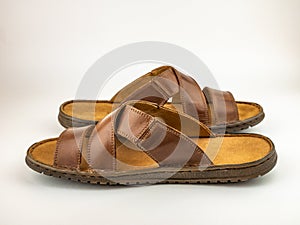 Male brown leather sandals. Close up on the white background.