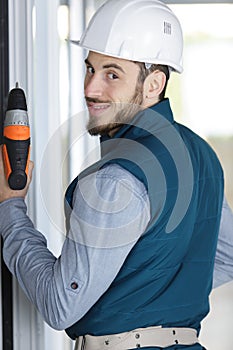 male builder with drill