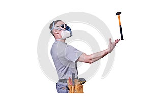 Male Builder, goggles and a respirator, is juggling a hammer, isolated on a white background.