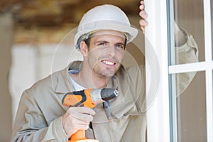 male builder using drill