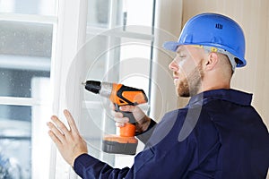 male builder using drill