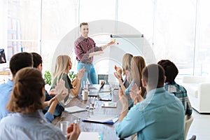 Male business trainer giving lecture photo