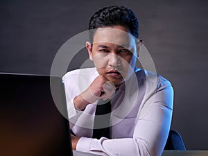 Male Businessman Looking at Camera with Cynical Look