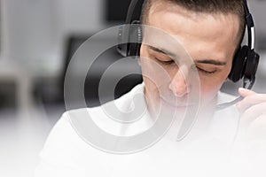 Male call centre operator doing his job