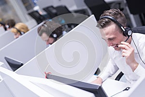 Male call centre operator doing his job