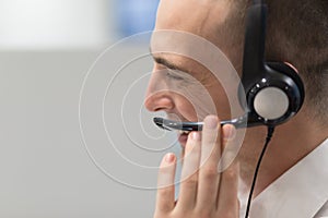 Male call centre operator doing his job