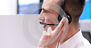 Male call centre operator doing his job