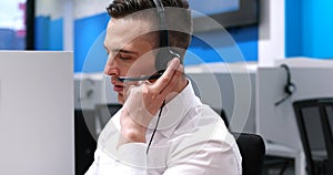 Male call centre operator doing his job