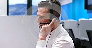 Male call centre operator doing his job