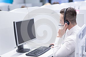 Male call centre operator doing his job