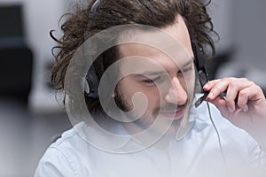 Male call centre operator doing his job