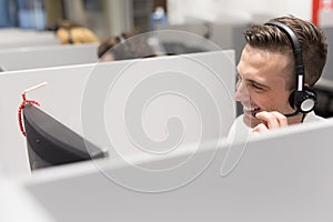 Male call centre operator doing his job