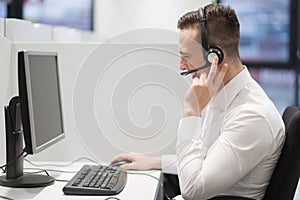 Male call centre operator doing his job