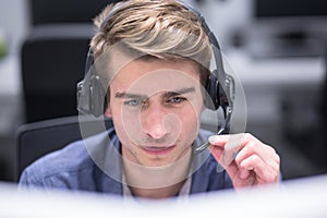 Male call centre operator doing his job