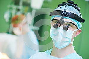 Male cardiac surgeon with cardiosurgery equipment photo