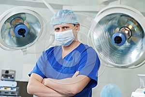 Male cardiac surgeon at cardiosurgery operating room photo