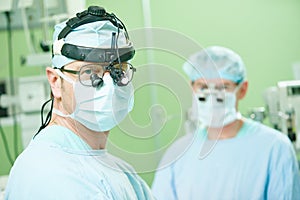 Male cardiac surgeon at child cardiosurgery operating room photo