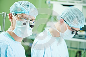 Male cardiac surgeon at child cardiosurgery operating room photo