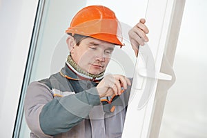 Male carpenter at lock installation