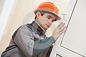 Male carpenter at lock installation