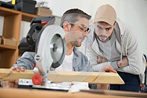 male carpenter training apprentice workshop