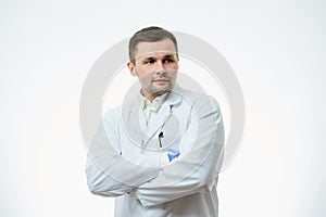 A male caucasian doctor in a white lab coat and blue disposable medical gloves