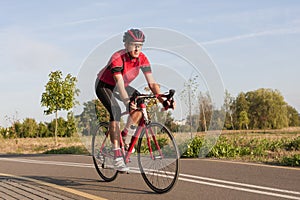 Male Caucasian Road Cyclist During Ride on Bike Outdoors