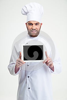 Male chef cook showing blank tablet computer screen