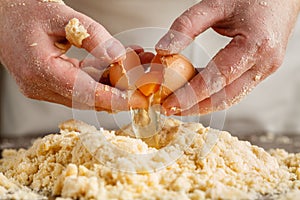 Male chef prepares. Man mixes whisk eggs. Top view